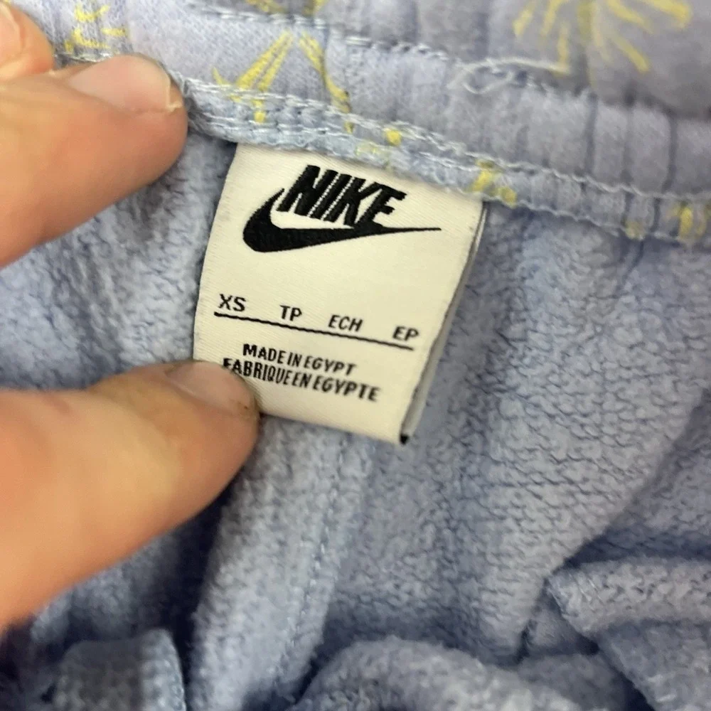 Nike NSW Club AOP Fleece Pants Pants Mens Size XS Blue Chill Snowflake Pattern‎